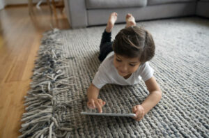 Girl lying on flooring | Thornton Flooring