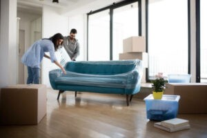 Couple moving sofa | Thornton Flooring